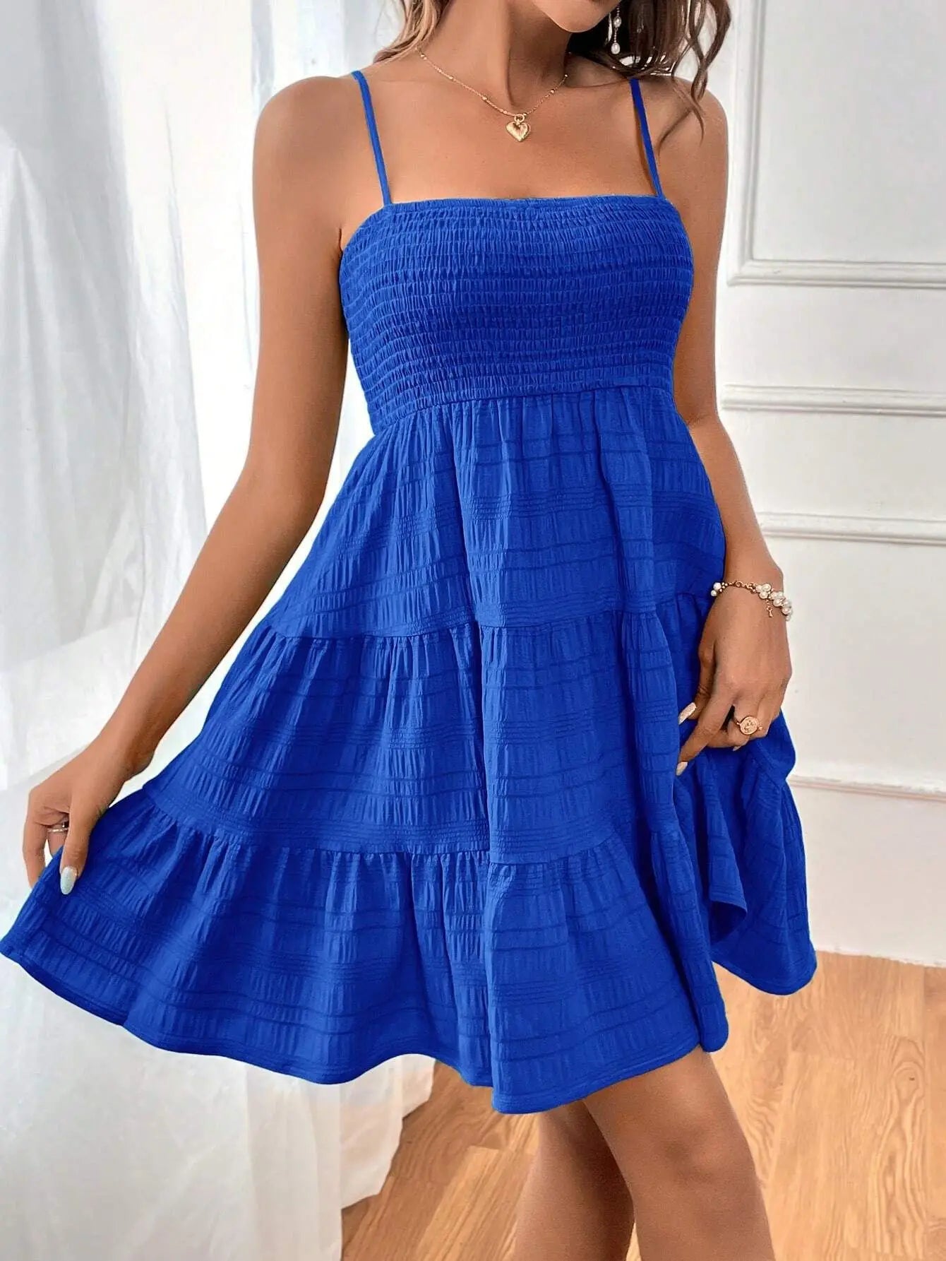 Light, feminine, and effortlessly chic — the perfect mini dress for sunny escapes.