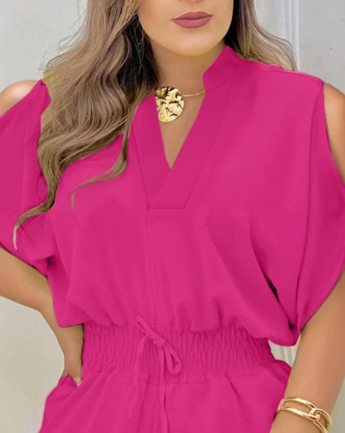 Summer 2026 elegance: cold-shoulder jumpsuit with a high waist.