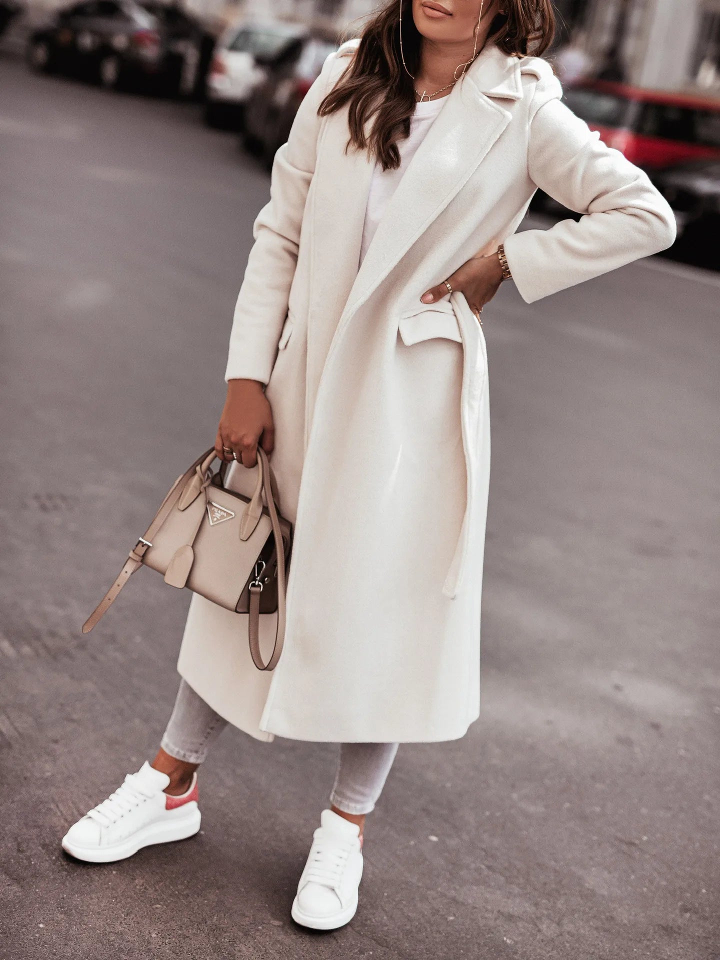Fashionable women’s wool coat with long sleeves and a belted wrap design. Elegant and versatile — perfect for spring and autumn.
