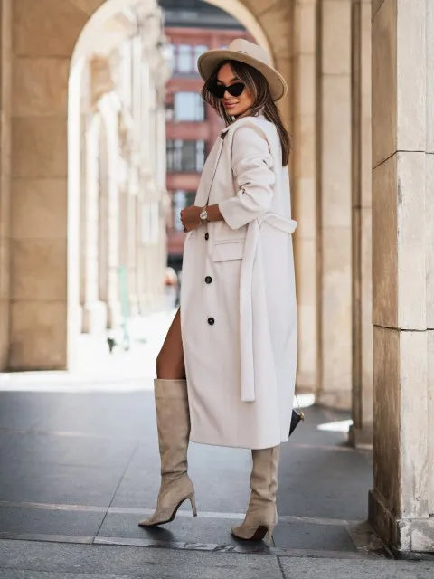 Timeless elegance for cold days. A sleek long-sleeve coat with a belted silhouette—where comfort meets modern sophistication.