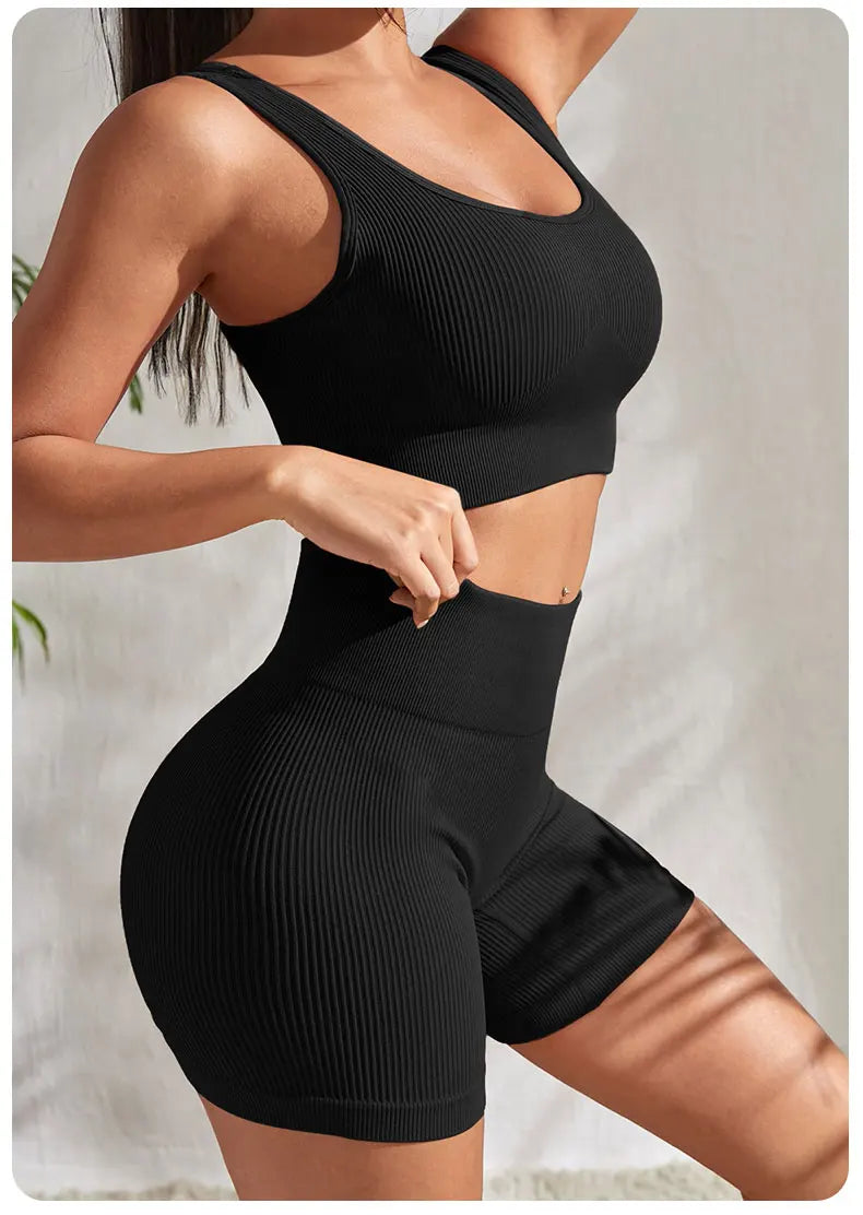 2-piece women's workout set – ribbed crop top and high-waist shorts.